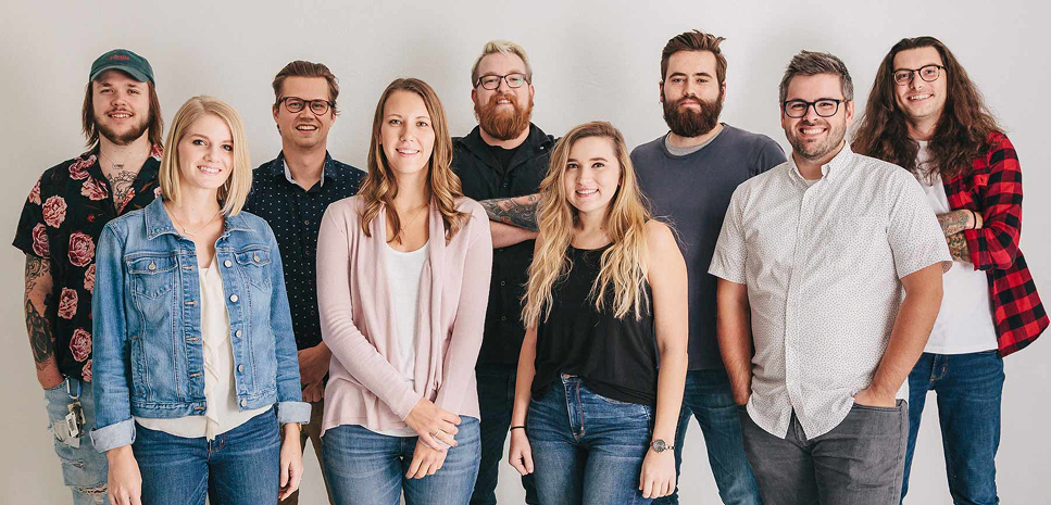 group of nine people standing